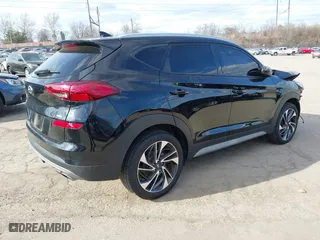 2021 Hyundai Tucson Sport with VIN KM8J3CAL6MU411855, listed as a IAAI auction lot 41694634 with 67,779 mi miles. Bid and sale history available at carsss.com. Image 4.