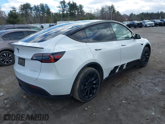 2023 Tesla Model Y Long Range with VIN 7SAYGDEE7PF832007, listed as a IAAI auction lot 41751598 with 14,126 mi miles and . Bid and sale history available at DreamBid. Image 4.