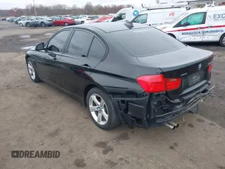 2014 BMW 3 Series 328i xDrive with VIN WBA3B5G52ENS10452, listed as a IAAI auction lot 41940823 with 177,830 mi miles. Bid and sale history available at carsss.com. Image 3.