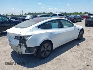 2018 Tesla Model 3 Long Range Battery with VIN 5YJ3E1EAXJF027179, listed as a IAAI auction lot 42059918 with 43,566 mi miles. Bid and sale history available at carsss.com. Image 4.