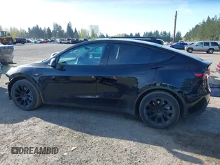 2021 Tesla Model Y Long Range with VIN 5YJYGDEE9MF301903, listed as a IAAI auction lot 42004007 with 26,740 mi miles. Bid and sale history available at carsss.com. Image 15.