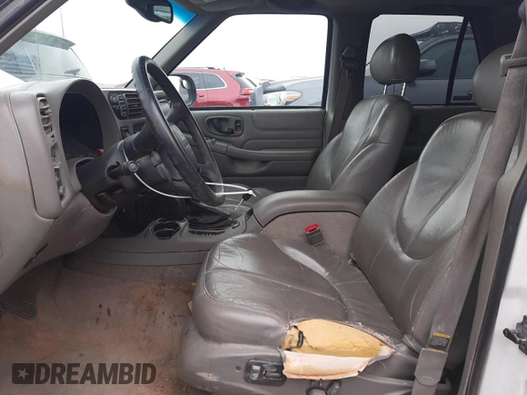1999 GMC Jimmy SLE with VIN 1GKDT13W1X2551085, listed as a Copart auction lot 50553055 with 189,974 mi miles and Salvage Title. Bid and sale history available at carsss.com. Image 7.