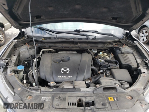 2014 Mazda CX-5 Sport with VIN JM3KE2BE9E0372370, listed as a Copart auction lot 58980165 with 175,477 mi miles and Salvage title. Bid and sale history available at DreamBid. Image 12.