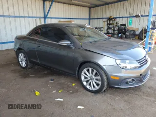 2014 Volkswagen Eos Komfort with VIN WVWBW8AH9EV006190, listed as a Copart auction lot 52390705 with 124,370 mi miles and Salvage Title. Bid and sale history available at DreamBid. Image 4.
