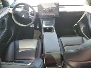 2023 Tesla Model Y Performance with VIN 7SAYGDEF8PF925238, listed as a Copart auction lot 46276925 with 28,201 mi miles and Salvage Title. Bid and sale history available at DreamBid. Image 8.