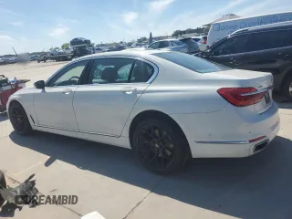 2018 BMW 7 Series 740i xDrive with VIN WBA7E4C52JGV24125, listed as a Copart auction lot 48164214 with 77,695 mi miles. Bid and sale history available at carsss.com. Image 2.