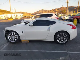 2014 Nissan 370Z Touring с VIN JN1AZ4EH2EM635420, выставлен на аукционе IAAI как лот 40862653 с пробегом 68 004 миль миль и . История ставок и продаж доступна на DreamBid. Изображение 14.