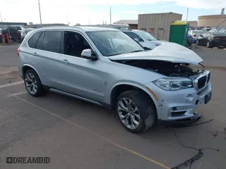 2018 BMW X5 xDrive40e iPerformance with VIN 5UXKT0C59J0W01768, listed as a IAAI auction lot 41603257 with NaN miles. Bid and sale history available at carsss.com. Image 1.
