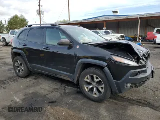 2015 Jeep Cherokee Trailhawk with VIN 1C4PJMBS9FW521872, listed as a Copart auction lot 55338955 with 146,602 mi miles and Salvage title. Bid and sale history available at DreamBid. Image 4.