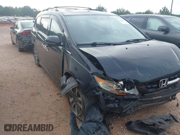 2015 Honda Odyssey Touring Elite with VIN 5FNRL5H90FB065004, listed as a IAAI auction lot 42461597 with 317,523 mi miles and . Bid and sale history available at DreamBid. Image 1.