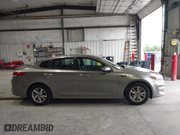 2016 Kia Optima LX with VIN 5XXGT4L33GG026183, listed as a IAAI auction lot 42156799 with 163,000 mi miles and . Bid and sale history available at carsss.com. Image 13.