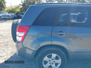 2006 Suzuki Grand Vitara Premium z VIN JS3TD943064100693, wystawiony jako IAAI lot #41772479 z przebiegiem 135 901 mil mil oraz . Historia ofert i sprzedaży dostępna na DreamBid. Obrazek 14.