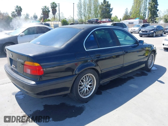 1997 BMW 5 Series 540iA with VIN WBADE6325VBW55346, listed as a IAAI auction lot 42085046 with 216,212 mi miles. Bid and sale history available at carsss.com. Image 4.