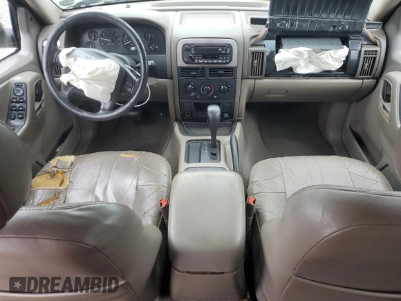 2004 Jeep Grand Cherokee Laredo with VIN 1J4GX48SX4C201569, listed as a Copart auction lot 58631585 with 271,124 mi miles and Salvage title. Bid and sale history available at DreamBid. Image 8.