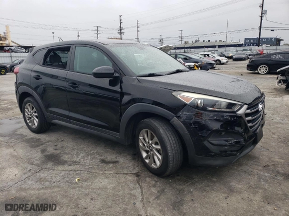 2018 Hyundai Tucson SE with VIN KM8J23A45JU698516, listed as a Copart auction lot 49079215 with 57,609 mi miles and Salvage Title. Bid and sale history available at carsss.com. Image 4.