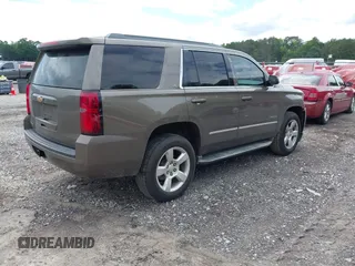 2015 Chevrolet Tahoe LT with VIN 1GNSCBKC5FR585138, listed as a IAAI auction lot 42420496 with 177,104 mi miles and . Bid and sale history available at DreamBid. Image 4.