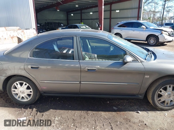 2004 Mercury Sable LS Premium z VIN 1MEHM55S54G607845, wystawiony jako IAAI lot #41812758 z przebiegiem 200 883 mil mil oraz . Historia ofert i sprzedaży dostępna na DreamBid. Obrazek 13.
