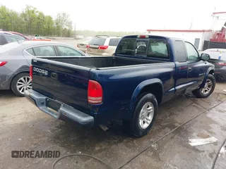 2002 Dodge Dakota Sport with VIN 1B7GL32X12S561414, listed as a IAAI auction lot 42060300 with 235,957 mi miles. Bid and sale history available at carsss.com. Image 4.