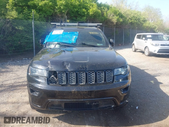 2018 Jeep Grand Cherokee Laredo E with VIN 1C4RJFAG2JC320441, listed as a IAAI auction lot 42095419 with 136,962 mi miles. Bid and sale history available at carsss.com. Image 12.