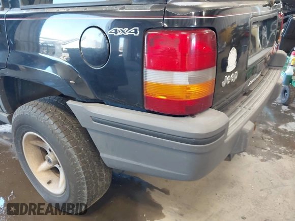 1995 Jeep Grand Cherokee Laredo z VIN 1J4GZ58Y3SC670696, wystawiony jako IAAI lot #42530934 z przebiegiem 165 658 mil mil oraz . Historia ofert i sprzedaży dostępna na DreamBid. Obrazek 6.