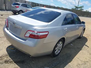 2007 Toyota Camry z VIN 4T1BB46K37U007610, wystawiony jako IAAI lot #42546223 z przebiegiem 252 363 mil mil oraz . Historia ofert i sprzedaży dostępna na DreamBid. Obrazek 4.