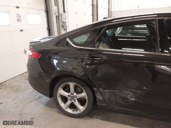 2014 Ford Fusion SE Hybrid with VIN 3FA6P0LU8ER151329, listed as a IAAI auction lot 41643515 with 121,161 mi miles. Bid and sale history available at carsss.com. Image 6.