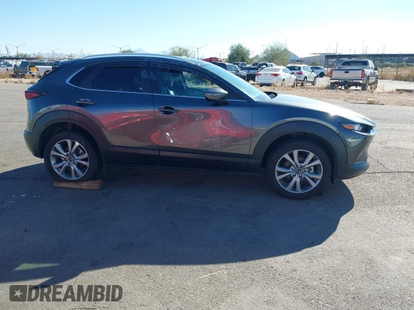 2022 Mazda CX-30 S Select z VIN 3MVDMBBL0NM415511, wystawiony jako IAAI lot #41513247 z przebiegiem Nie podano mil oraz . Historia ofert i sprzedaży dostępna na DreamBid. Obrazek 14.