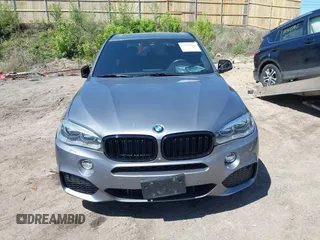 2014 BMW X5 xDrive50i with VIN 5UXKR6C57E0J72301, listed as a IAAI auction lot 39379887 with 117,012 mi miles. Bid and sale history available at carsss.com. Image 12.