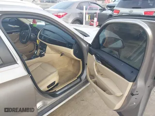 2014 BMW X1 sDrive28i with VIN WBAVM1C52EVW48857, listed as a IAAI auction lot 41179830 with 113,315 mi miles. Bid and sale history available at carsss.com. Image 5.