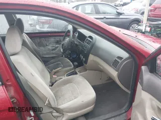 2009 Kia Spectra EX with VIN KNAFE222695621925, listed as a IAAI auction lot 40657622 with 135,647 mi miles. Bid and sale history available at carsss.com. Image 5.