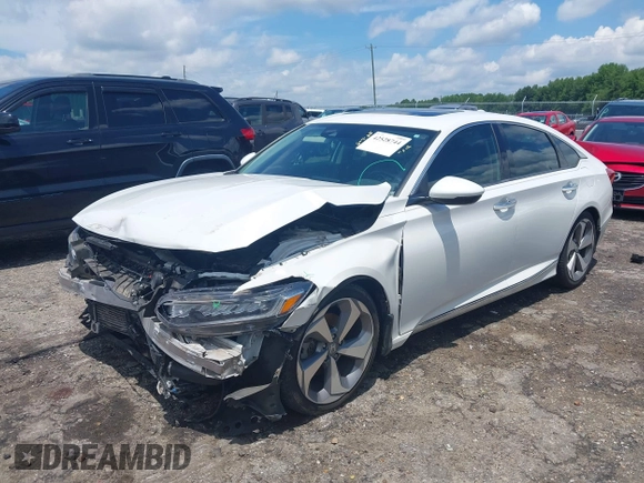 2019 Honda Accord Touring with VIN 1HGCV2F96KA015987, listed as a IAAI auction lot 42528744 with 174,735 mi miles and . Bid and sale history available at DreamBid. Image 2.