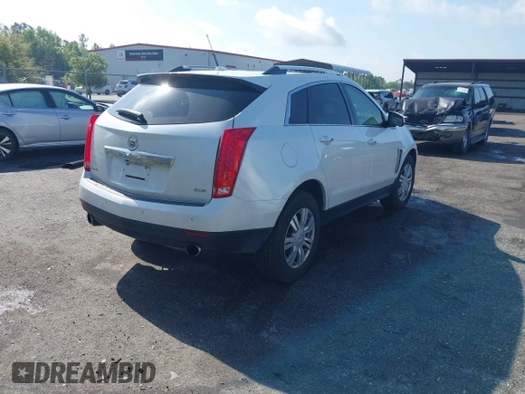 2013 Cadillac SRX Luxury Collection with VIN 3GYFNCE33DS608040, listed as a IAAI auction lot 41912860 with 128,295 mi miles and . Bid and sale history available at DreamBid. Image 4.