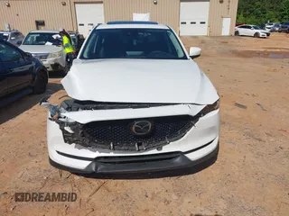 2021 Mazda CX-5 Grand Touring with VIN JM3KFBDM3M0493752, listed as a IAAI auction lot 42456854 with 35,122 mi miles and . Bid and sale history available at DreamBid. Image 12.