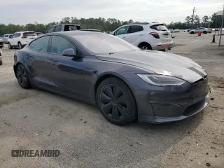 2022 Tesla Model S with VIN 5YJSA1E5XNF471212, listed as a Copart auction lot 57384025 with Not provided miles and Salvage title. Bid and sale history available at DreamBid. Image 4.