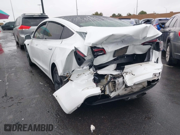 2020 Tesla Model 3 Standard Range Plus with VIN 5YJ3E1EA2LF740225, listed as a IAAI auction lot 41781554 with 46,703 mi miles. Bid and sale history available at carsss.com. Image 3.