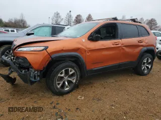 2015 Jeep Cherokee Trailhawk z VIN 1C4PJMBS7FW704980, wystawiony jako Copart lot #70334472 z przebiegiem 127 562 mil mil oraz Szkoda całkowita • Salvage title. Historia ofert i sprzedaży dostępna na DreamBid. Obrazek 1.