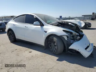 2022 Tesla Model Y Performance with VIN 7SAYGDEF9NF392197, listed as a Copart auction lot 57259105 with 43,400 mi miles and Salvage title. Bid and sale history available at DreamBid. Image 4.