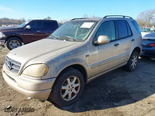 2001 Mercedes-Benz M-Class with VIN 4JGAB72E51A247926, listed as a IAAI auction lot 41277111 with 208,817 mi miles. Bid and sale history available at carsss.com. Image 2.