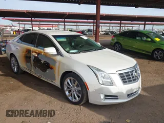 2014 Cadillac XTS Luxury with VIN 2G61M5S35E9199253, listed as a IAAI auction lot 41400558 with 112,955 mi miles. Bid and sale history available at carsss.com. Image 1.