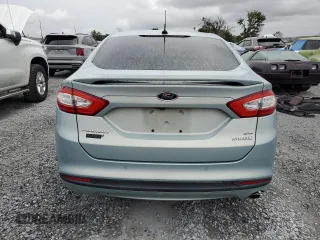 2013 Ford Fusion SE Hybrid z VIN 3FA6P0LU6DR174719, wystawiony jako Copart lot #62877715 z przebiegiem 52 884 mil mil oraz Szkoda całkowita • Salvage title. Historia ofert i sprzedaży dostępna na DreamBid. Obrazek 6.
