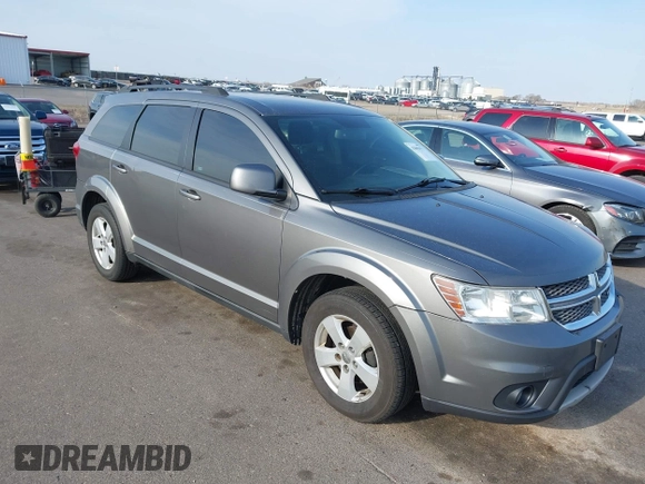2012 Dodge Journey SXT z VIN 3C4PDCBG9CT208092, wystawiony jako IAAI lot #42065471 z przebiegiem 208 794 mil mil oraz . Historia ofert i sprzedaży dostępna na DreamBid. Obrazek 1.