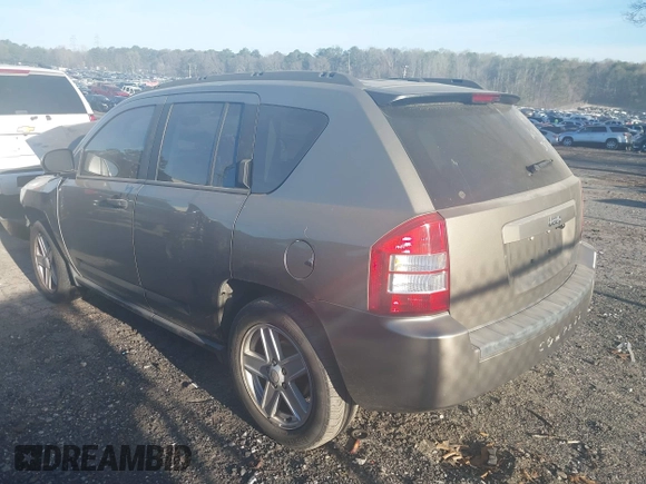 2007 Jeep Compass Sport with VIN 1J8FT47W57D158543, listed as a IAAI auction lot 41817636 with 241,439 mi miles. Bid and sale history available at carsss.com. Image 3.