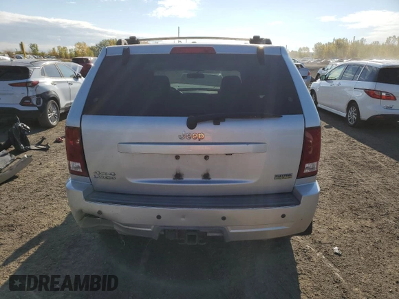 2009 Jeep Grand Cherokee Laredo with VIN 1J8HR48P39C559192, listed as a Copart auction lot 74007094 with 105,997 mi miles and Salvage Title. Bid and sale history available at carsss.com. Image 6.