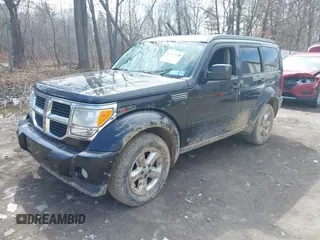 2008 Dodge Nitro SXT with VIN 1D8GU28K98W225158, listed as a IAAI auction lot 41911789 with 180,450 mi miles. Bid and sale history available at carsss.com. Image 2.