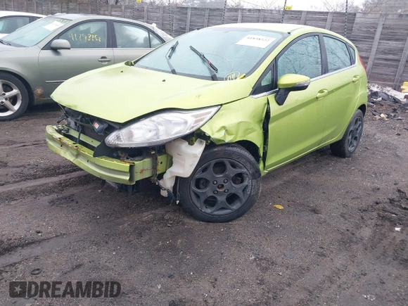 2011 Ford Fiesta SES with VIN 3FADP4FJ8BM107209, listed as a IAAI auction lot 41838522 with 142,730 mi miles. Bid and sale history available at carsss.com. Image 2.