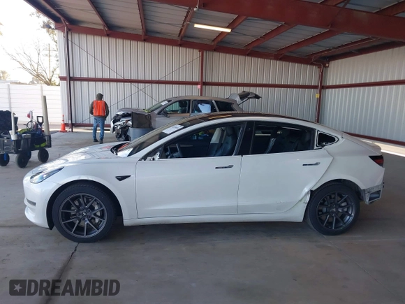2021 Tesla Model 3 Long Range with VIN 5YJ3E1EB3MF003027, listed as a IAAI auction lot 41859036 with 102,302 mi miles and . Bid and sale history available at carsss.com. Image 15.