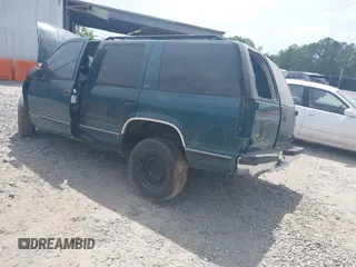 1996 GMC Yukon with VIN 1GKEC13R7TJ704518, listed as a IAAI auction lot 42095936 with 1 mi miles. Bid and sale history available at carsss.com. Image 3.