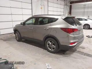 2017 Hyundai Santa Fe 2.4L z VIN 5XYZUDLBXHG447389, wystawiony jako IAAI lot #42249551 z przebiegiem 178 084 mil mil oraz . Historia ofert i sprzedaży dostępna na DreamBid. Obrazek 3.