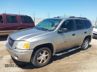 2003 GMC Envoy SLT with VIN 1GKDS13S732150215, listed as a IAAI auction lot 42048209 with 329,719 mi miles. Bid and sale history available at carsss.com. Image 2.