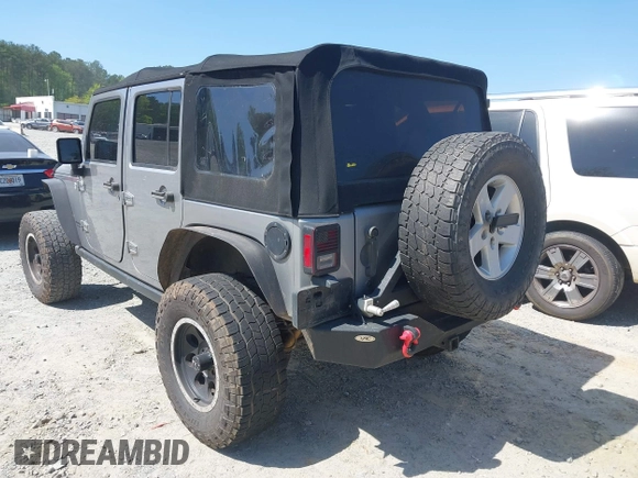 2014 Jeep Wrangler Unlimited Sport with VIN 1C4BJWDG4EL292421, listed as a IAAI auction lot 42034343 with 157,820 mi miles. Bid and sale history available at carsss.com. Image 3.